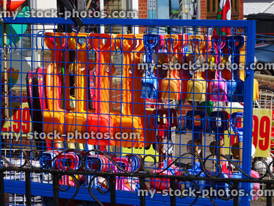 Stock image of seaside gift shop selling colourful buckets and spades