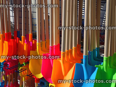Stock image of seaside gift shop selling buckets and spades, wooden handles