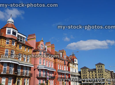 Stock image of painted Edwardian townhouses in row, balconies, bay windows, chimneys