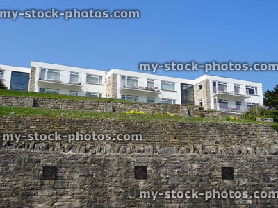 Stock image of 1970s seaside flats on hill / slope with tiers