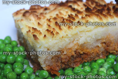 Stock image of cottage pie portion, showing mincemeat / mashed-potato / garden peas