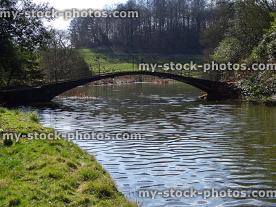 Stock image of small stone bridge arch over river, winter countryside scene