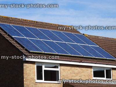 Stock image of solar powers on modern roof / rooftop, green energy