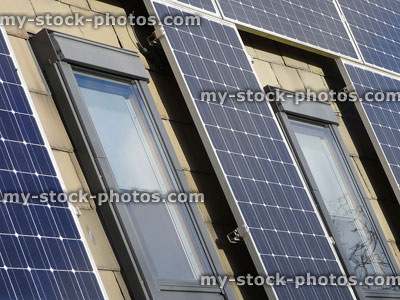 Stock image of solar panels / cells on roof, around skylight windows