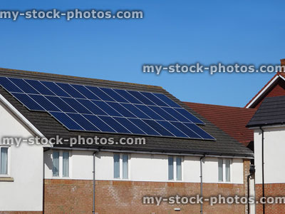 Stock image of modern building with solar panels / environmentally friendly, renewable energy