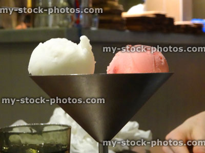 Stock image of stainless steel Martini glass dish, strawberry / vanilla gelato ice cream dessert / sorbet scoops