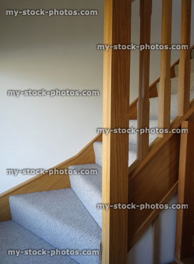 Stock image of modern, light oak stair spindles / wooden staircase corner balusters