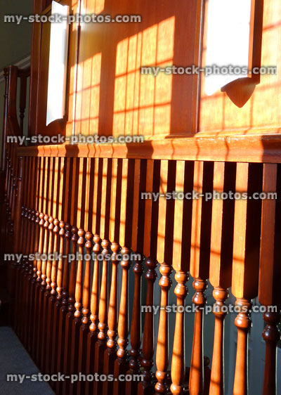 Stock image of elegant wooden staircase spindles / stair balustrades / balustrading, varnished