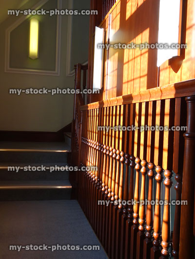 Stock image of wooden staircase spindles / stair balustrades in house, varnished