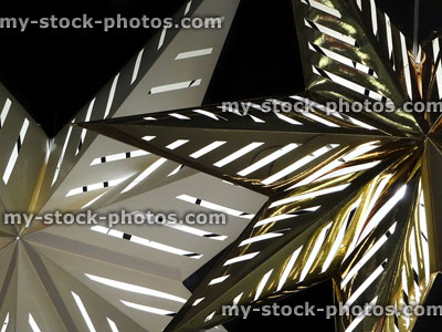 Stock image of hanging star shaped lights made from heatproof card