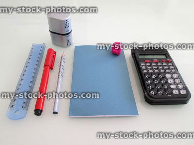 Stock image of school stationery, calculator, notebook, rubber, pencil, pen, ruler