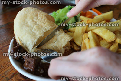 Stock image of steak pie, chips / fries, carrots, cabbage, gravy, puff pastry