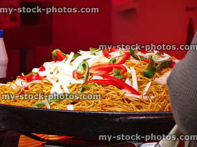 Stock image of Chinese wok stir-fry with peppers and noodles