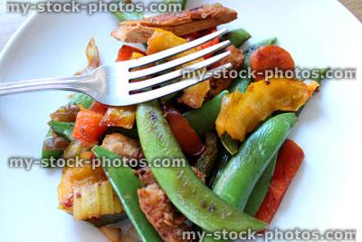 Stock image of healthy chicken stir fry, sugar snap peas, peppers