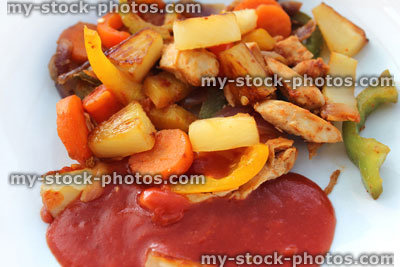 Stock image of homemade sweet and sour chicken stir fry, sauce
