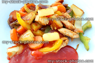 Stock image of homemade sweet and sour chicken stir fry, sauce