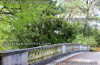 Stock image of old stone bridge in garden, cast stone balustrading