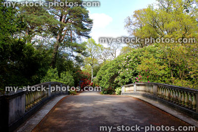 Stock image of old stone bridge in garden, with ornamental balustrading