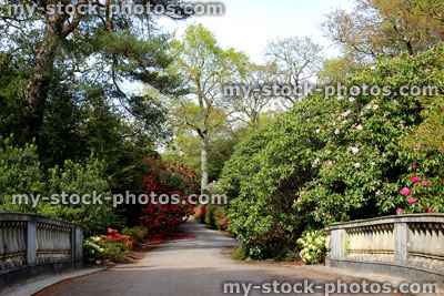 Stock image of old stone bridge in garden, with cast balustrading