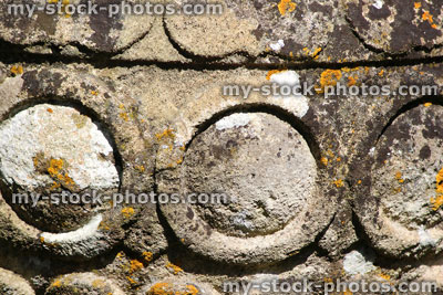 Stock image of ancient stone pot in garden, covered in lichen