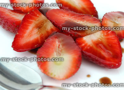 Stock image of sliced strawberries with balsamic vinegar and sugar, healthy dessert