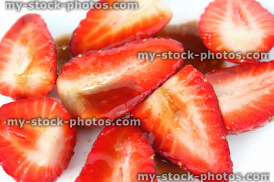 Stock image of sliced strawberries with balsamic vinegar and sugar, summer fruit