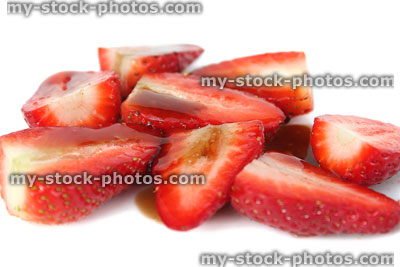 Stock image of sliced strawberries with balsamic vinegar and sugar, summer berries
