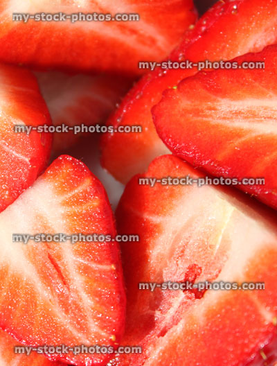 Stock image of sliced strawberries in halves, healthy eating, health benefits of fresh fruit