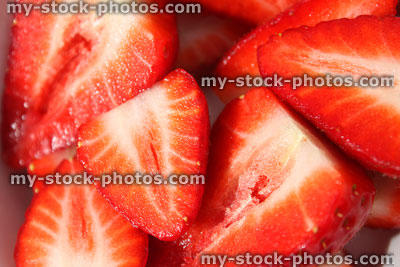 Stock image of strawberries sliced in half, healthy eating, fresh fruit halves