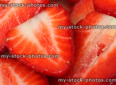 Stock image of sliced strawberry halves close up, healthy eating, fresh summer fruit