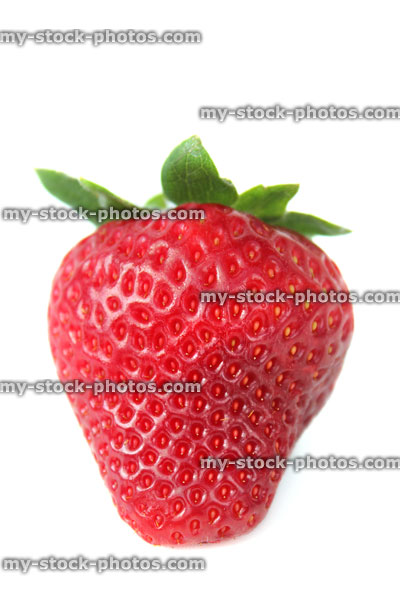 Stock image of single ripe strawberry fruit isolated against white background