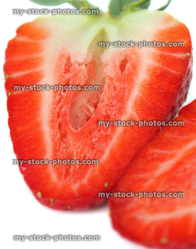 Stock image of two strawberry halves, cut / dissected, inside flesh, summer fruit