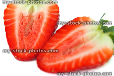 Stock image of red, ripe strawberry slices, showing inside of fruit
