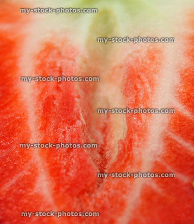 Stock image of red, ripe strawberry slice, summer fruit inside flesh