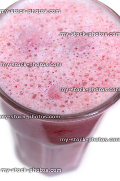 Stock image of strawberry smoothie / milkshake in American diner drinking glass, protein drink
