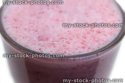 Stock image of strawberry smoothie / milkshake in American diner drinking glass, protein drink