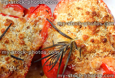 Stock image of roasted stuffed peppers, topped with breadcrumbs and cheese, vegetarian dish