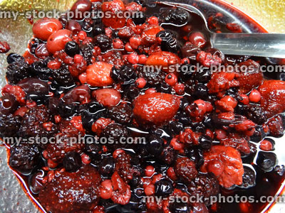 Stock image of glass bowl filled with summer fruit / berries, strawberries, blackberries, redcurrants