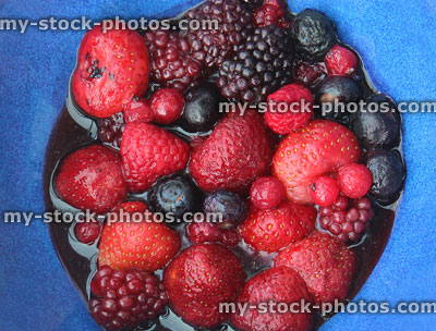 Stock image of juicy summer fruit / berries in dish, strawberries, blackberries