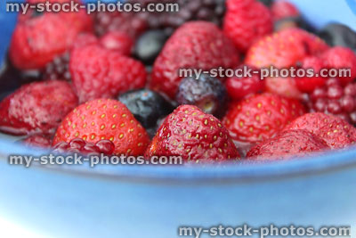Stock image of dish of summer fruit berries, strawberries, raspberries, blueberries