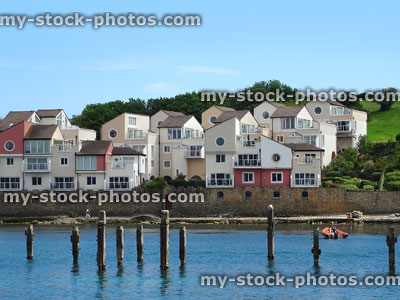 Stock image of modern coastal houses overlooking seafront and old pier