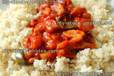Stock image of homemade sweet and sour chicken stir fry, brown rice