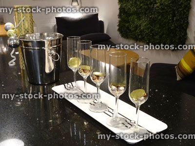 Stock image of five wine-glasses on tray with silver wine bucket