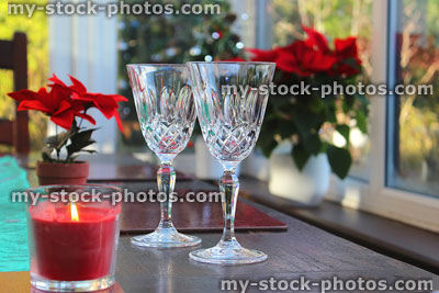 Stock image of cut crystal wine glasses on dining table at Christmas