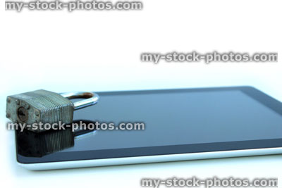 Stock image of tablet computer with padlock reflection on glass screen