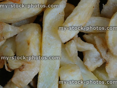 Stock image of greasy chips close up, unhealthy fatty food, fish and chips