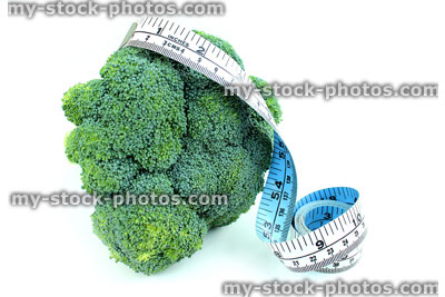 Stock image of tape measure with broccoli, fresh organic broccoli vegetable