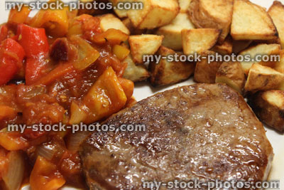 Stock image of griddled tenderloin steak with roasted potatoes / chunky chips, tomato ratatouille