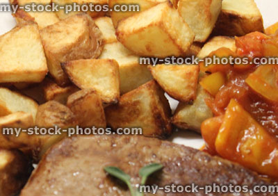 Stock image of griddled tenderloin steak with roasted potatoes / chunky chips, tomato ratatouille