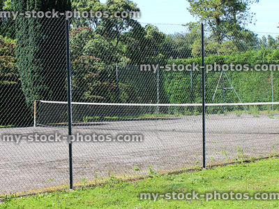 Stock image of public tennis court made of tarmac, park lawn